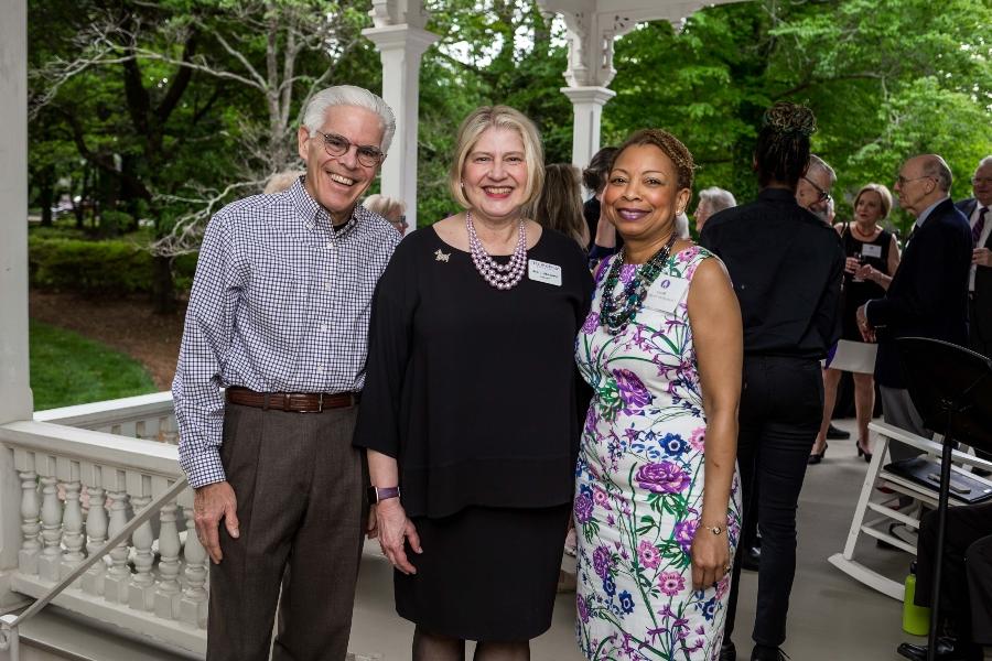 The president of Agnes Scott College poses for a photo with two donors. 